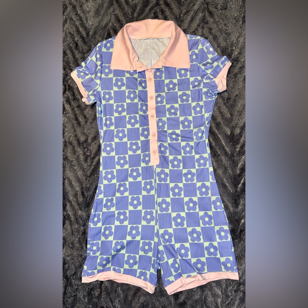 Cute. Sexy. Comfy. One piece button down romper shorts. Large, but run small.